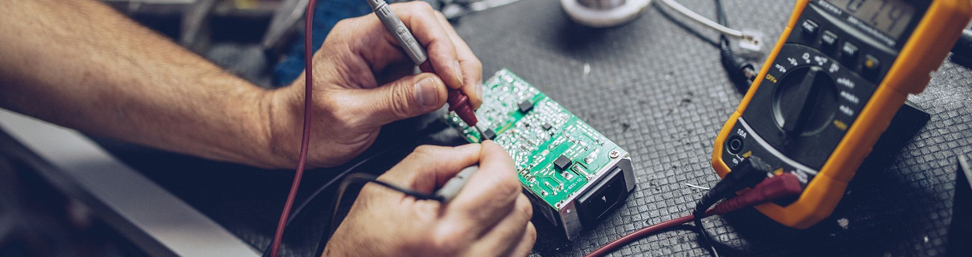 student working on electronics
